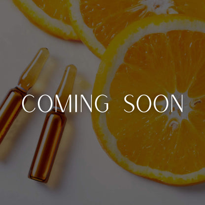 Orange slices and ampoules with 'COMING SOON' text 
